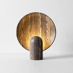 a wooden object sitting on top of a white table