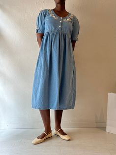 - Vintage button up denim dress - 100% cotton - Made in India - Tagged M Bust: 20" Length: 44.5" We are not responsible for lost, stolen, or damaged packages once they have been shipped. Any additional customs duties or taxes incurred on international orders are the responsibility of the buyer. Please note that our items are vintage and may have minor flaws or imperfections due to their age, which adds to their unique character. Button-up Cotton Denim Dress With Pockets, Cotton Button-up Denim Dress With Pockets, Button-up Denim Dress With Pockets, Short Sleeve Cotton Denim Dress With Pockets, Cotton Denim Dress With Pockets, Cotton Denim Dress With Pockets And Short Sleeves, Button-up Denim Blue Cotton Dress, Denim Blue Cotton Button-up Dress, Knee-length Denim Blue Cotton Dress