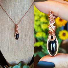 "Beautiful Black Obsidian wrapped in copper wire with tarnish resistant coating and a copper 20\" chain." Elegant Hand Wrapped Copper Necklaces, Elegant Black Copper Jewelry, Hand Wrapped Black Copper Jewelry, Unique Black Copper Jewelry, Handmade Black Copper Wire Jewelry, Handmade Black Copper Necklaces, Handmade Black Copper Necklace, Black Copper Pendant Jewelry, Black Copper Wire Hand Wrapped Necklaces