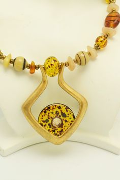 This great necklace from Chico's is strung on memory wire, and is adjustable, so it will fit a variety of sizes. Glass beads in shades of amber, cream and browns are accented by a pendant with a glass donut. This necklace will go with a lot of different outfits, and is sure to become a favorite piece. Necklace is about 18 inches long, and has an adjustment of about 4 inches. For more lovely vintage accessories, please visit: www.etsy.com/shop/CloesCloset?section_id=10559789 Bead Choker, Vogue Sewing, Vogue Sewing Patterns, Butterick Sewing Pattern, Memory Wire, Unique Gifts For Her, Choker Necklaces, Beaded Choker, Vintage Costume Jewelry