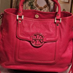 Tory Burch Amanda Pebbled Pink Leather Satchel/Tote Bag With Gold-Tone Metallic Hardware In Excellent Pre-Loved Condition. An Ever-Chic & Versatile Satchel Shoulder/ Tote Bag Crafted From Rich Pebbled Leather & Accented With Medallion Logo, Which Add Sophistication Compliments Any Outfit, For That Special Occasion. Removable Strap To Be Worn As A Crossbody Bag. Dual Leather Handles, Magnetic Snap Closure With 2 Exterior Pockets. Interior Zipper Pocket, 2 Multifunctional Pockets, Signature Logo Embossed Fabric Lining. Minimal Sign Of Wear On The Handles, Signs Of Ink On The Interior Top Closure With A Small Spot On The Interior Fabric. Classic Bag Perfect To Fit All Essentials For All Pink Textured Leather Rectangular Bag, Luxury Pink Leather Satchel, Pink Rectangular Textured Leather Bag, Pink Top Handle Bag With Textured Leather, Pink Textured Leather Top Handle Bag, Pink Leather Shoulder Bag With Gold-tone Hardware, Pink Textured Leather Rectangular Shoulder Bag, Pink Textured Leather Shoulder Bag For Travel, Pink Leather Shoulder Bag With Detachable Handle