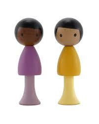 two toy figures are standing next to each other on a white background, one is purple and the other is yellow