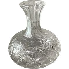 a clear glass vase sitting on top of a table