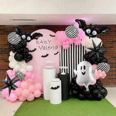 a halloween themed party with balloons and decorations