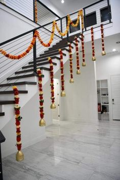 a set of stairs decorated with garlands and bells