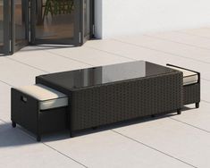 an outdoor coffee table with storage underneath it