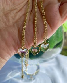 "This beautiful super cute dainty heart shape necklace can be worn with any outfit and it's a stunning piece that will certainly catch the attention of anyone. And made of high quality UV resin. Made with love using real dried sweet alyssum flower. * FREE GIFT WRAPPING! * Please select the gift box ribbon color when you process your order. Thank you! * Your piece will come packaged safely in one of my beautiful gift box with velvet pink jewelry bag wrapped in sheer ribbon (ribbon is attached to Alyssum Flowers, Heart Shaped Necklace, Flower Girl Gifts, Pink Jewelry, Free Gift Wrapping, Ribbon Colors, Dainty Necklace, Beautiful Gift Boxes, Jewelry Bags