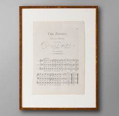 an old sheet music score in a wooden frame