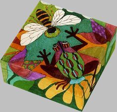 an artistically painted box with two bees on it