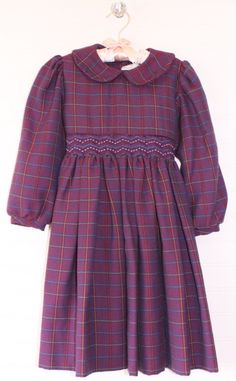 This is a beautiful Vintage baby dress. Purple plaid Sarah Louise dress, smocked, sized for 4Y. Four button tie and closure on the back. This dress would be perfect for Christmas, Church, or any special winter event. Anytime you want to show off your beautiful baby would be a time to wear this wonderful item. *email me if you need measurements Fitted Plaid Dresses With Smocked Bodice, Fitted Plaid Dress With Smocked Back, Fitted Plaid Smocked Dress With Smocked Bodice, Fitted Plaid Smocked Dress, Purple Girls Dress, Vintage Baby Dresses, Girls Smocked Dresses, Winter Event, Purple Plaid