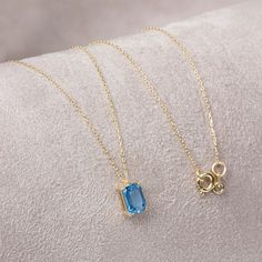 "Topaz stone, which is among the most important mines, is in the quartz group. Blue topaz is believed to promote truth and forgiveness by relaxing the soul and body. Our 14k solid gold blue topaz necklace is a stylish jewel for you and your loved ones with its elegant design. Time to pamper yourself and your loved ones... The color of those born in December is blue topaz. 🤍🤍 Special gifts for your special moments. We produce our jewelery for you in the most perfect way. 🤍🤍 All of our product Minimalist Topaz Birthstone Jewelry, Dainty Blue Topaz Gemstone Jewelry, Minimalist Topaz Jewelry As A Gift, Fine Jewelry Blue Topaz Birthstone Necklace For Gifts, Faceted Blue Topaz Jewelry For Gift, Blue Topaz Minimalist Jewelry, December Birthstone Necklace, Rectangle Necklace, Blue Topaz Necklace