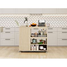 a kitchen with white cabinets and an island in the middle, filled with various items