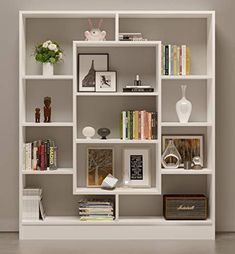 a bookshelf filled with lots of different types of books