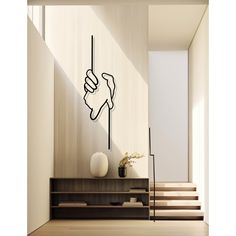 a drawing of a hand holding a stick in front of a stair case and wall