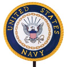 the united states navy emblem on a pole