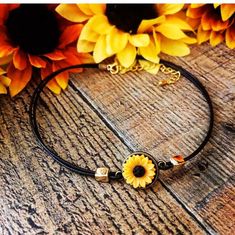 This is adorable sunflower choker 13 inches with a 2 inch extension, made out of Brown leather with gold metal beads, and a beautiful sunflower,If you need a larger size just let me know Adjustable Hippie Flower Jewelry, Adjustable Yellow Hippie Jewelry, Cute Adjustable Choker Jewelry, Adjustable Yellow Sunflower Design Jewelry, Cute Adjustable Yellow Necklace, Cute Adjustable Yellow Necklaces, Adjustable Yellow Choker Jewelry, Yellow Bohemian Adjustable Jewelry, Adjustable Yellow Bohemian Jewelry