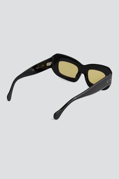 Acetate Black Baraka Sunglasses from Port Tanger. Rectangular frame. Bold curves and modern silhouette. Designed for a comfortable unisex fit. Stainless steel hardware. Gold logo and details. Includes a premium case with a protective PU leather pouch and a cleaning cloth. - Acetate - Handmade in Japan - Lens: 57mm / bridge: 19mm / temple: 140mm Luxury Modern Shield Sunglasses In Acetate, Eyewear Womens, Gold Logo, Sunglasses & Glasses, Leather Pouch, Metal Hardware, Silver Color, Pu Leather, Temple