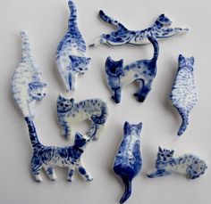 several blue and white ceramic cats are displayed on an instagramtion page with the caption