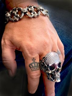 RING PROFILE: 🔱 Unleash your inner rebel and make a powerful statement with our stunning Crystal-Encrusted Skull Ring. Designed for the fearless who dare to stand out from the crowd, this mesmerizing piece is a true symbol of strength, individuality, and style. Crafted with meticulous attention to detail, our skull ring boasts a rugged yet refined appeal. The gleaming contrasting metal sets the stage for a striking centerpiece—a daring skull adorned with a brilliant array of sparkling crystals. Symbol Of Strength, Exotic Jewelry, Tarnish Remover, Skull Jewelry, Bespoke Jewellery, Crystal Skull, Cool Nail Designs, Engraved Jewelry, Skull Ring