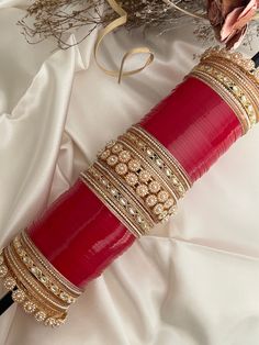 Bridal indian red wedding chooda. size 2.8 .  perfect for your wedding day.  includes - 24 red bangles (each hand)                    16 gold size bangles.( each hand) total-  48 red bangles( both hands)             32 gold bangles (both hands) Style tip- ----------- Pair it with any beautiful traditional outfits  and flaunt with Unique style of collection from us. Perfect match for Festival and Traditional wear.  Take Care Tips-  ---------------- Kee away from perfume, Hair spray and. Moisture. Bridal Chooda, Jewellery Kundan, Red Bangles, Kundan Jewelry, Ziplock Bags, Kundan Jewellery, Red Wedding, Wedding Bracelet, Gold Bangles