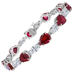 Magnificent Ruby and Diamond Bracelet 10 Pear shaped Rubies weighing approximately 12.92 Carats, alternating with 10 Marquise and Pear shaped Diamonds weighing approximately 5.09 Carats. Each Diamond is individually certified by GIA as DEF color and SI clarity. Set in Platinum and measuring 7.00 inches. Lock is made out of 18 Karat White Gold for durability and security. Ruby Diamond Bracelet, Heart Shaped Bracelet, Ruby Heart, Bracelet Tennis, Expensive Jewelry, Heart Shaped Diamond, Ruby Jewelry, Pear Shaped Diamond, Ruby Diamond