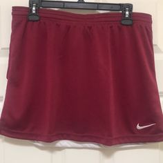 Great Knit Lacrosse/Tennis/Golf/Pickleball Skirt By Nike! In A Red Wine Shade With White Stripes And Iconic Embroidered Swoosh, This Skirt Has Both Style And Versatility. Elastic Waistband With A Drawstring Makes For A Comfortable, Customized Fit. Dri-Fit Technology Keeps You Cool And Dry. Perfect To Wear Over Leggings For More Coverage. Coordinating Tops Under Separate Listings. Size Large (Waist: 16” Length: 15”) And Size Extra Large (Waist: 17.25” Length: 16”) Available. New With Tags! Pickleball Skirt, Athleisure Skirt, Nike Skirts, Keep Your Cool, Lacrosse, Pickleball, White Nikes, Athleisure, Red Wine