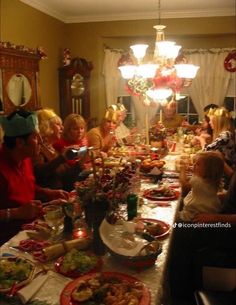 a group of people sitting around a dinner table