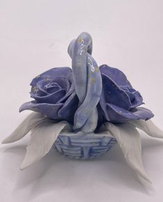 a blue and white vase with flowers in it