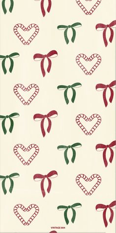 a white background with red and green bows on it's neck ties, in the shape of hearts