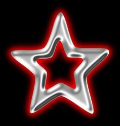 a shiny silver star with red highlights on a black background stock photo - 1307982