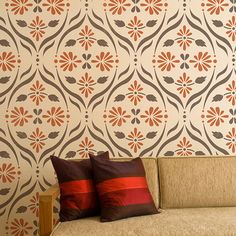 a living room with a couch, coffee table and wallpaper on the walls behind it