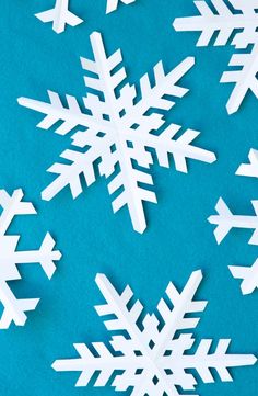 paper snowflakes on a blue background