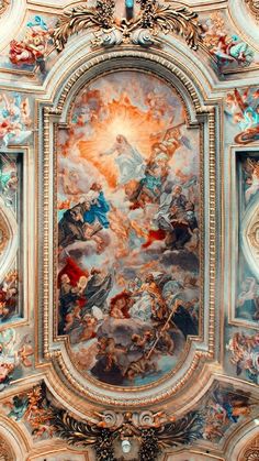 an ornate painting on the ceiling of a building