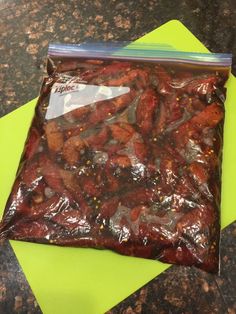 a bag filled with meat sitting on top of a counter