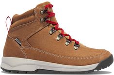 a pair of brown hiking boots with red laces on the outstretches