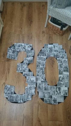 the number 50 is made out of photos and sits on the floor next to a chair