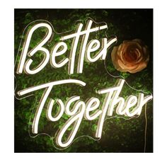 a neon sign that says better together with a rose