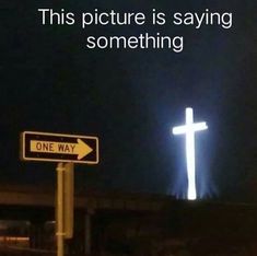 a street sign that has a cross on it and the words'this picture is saying something one way '