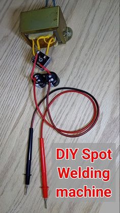 the diy spot welding machine is connected to an electrical device with wires and terminals