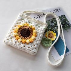 a crocheted bag with a flower on it