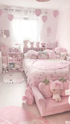 a pink bedroom with lots of stuffed animals on the bed and in the corner is a teddy bear chair