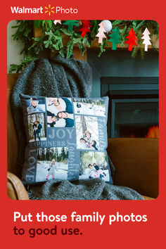 a pillow with pictures on it sitting in front of a fire place next to a christmas tree