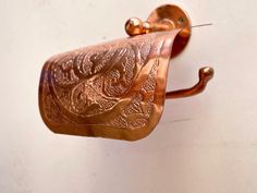 This beautifully handcrafted toilet paper holder is made from high-quality Moroccan copper, offering a unique, traditional touch to your bathroom decor. Each piece is meticulously engraved by hand using traditional tools, adding authenticity and charm to every detail. Features: ✔️ 100% Handmade ✔️ Material: Copper ✔️ Easy Installation (all hardware included) ✔️ Premium Packaging Package Includes: ✔️ Copper Toilet Paper Holder ✔️ Mounting Hardware ✔️ Secure Packaging for Safe Delivery Shipping & Customer Care: ✔️ Ships within 4-6 business days ✔️ Full inspection before shipping to ensure quality ✔️ Customer service available throughout the process Warranty: ✔️ 5-year warranty for peace of mind ✔️ 30-day Free Return & Exchange ✔️ Covers damages, defects, and missing parts Enjoy a touch of Mo Copper Toilet, Unique Toilet Paper Holder, Brass Toilet Paper Holder, Bathroom Toilet Paper Holders, Mounted Toilet, Toilet Paper Holders, Paper Holders, Wall Mounted Toilet, Copper Wall