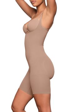 Designed to shape your waist and accentuate your butt, this bodysuit provides targeted compression for a sleek look under outfits. The core and waist areas feature medium compression, while the thigh area offers strong, double-ply compression. The open-bust silhouette allows you to wear your own bra, and the rear offers light support for a lifted, enhanced look. Open bust Adjustable straps Open gusset, open gusset 79% nylon, 21% spandex Machine wash, tumble dry Imported Shape Your Waist, Open Bust, Sleek Look, Kim Kardashian, Adjustable Straps, Sleek, Nordstrom, Spandex, Bra