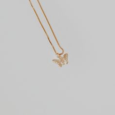 This butterfly necklace will add a delicate touch to any look with its chain and pendant. Treat yourself or a loved one to a unique piece of jewelry today! ∙ D E T A I LS ∙- 18k Gold Filled- 18 inches in length- Box Chain - Hypoallergenic (lead + nickel free) ∙ G O L D ∙ F I L L E D ∙ Gold-filled components contain 100+ times more real gold than gold-plated components and are both durable and tarnish resistant. It is more affordable and accessible than solid gold but higher quality than gold plated. Dainty Gold Butterfly Jewelry, Dainty Gold-plated Jewelry With Butterfly Charm, Dainty Gold Plated Jewelry With Butterfly Charm, Dainty Gold-plated Butterfly Jewelry, Rose Gold Butterfly Charm Jewelry As Gift, Dainty Gold Plated Butterfly Jewelry, Gold-plated Butterfly Jewelry With Delicate Chain, Rose Gold Jewelry With Butterfly Charm As Gift, Dainty Rose Gold Butterfly Pendant Necklace