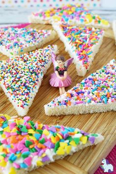 there are many pieces of cake with sprinkles on the cutting board next to each other