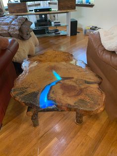 a wooden table with blue flames on it in a living room