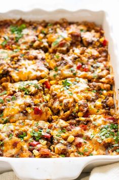 a casserole dish filled with meat and vegetables