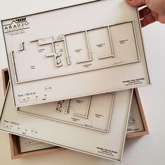 two boxes are stacked on top of each other with the floor plan in it's box