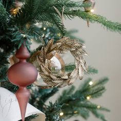 a christmas tree with ornaments hanging from it